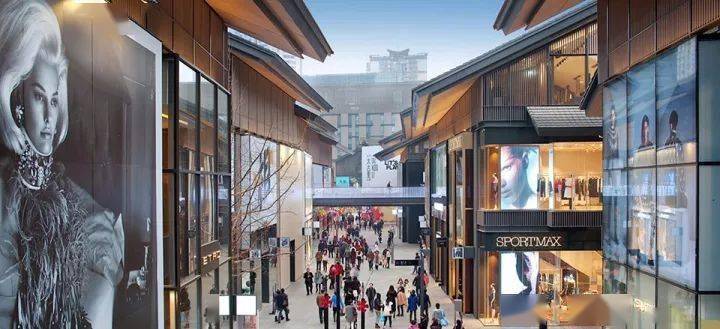 A bustling commercial street at Chengdu Taikoo Li features m
