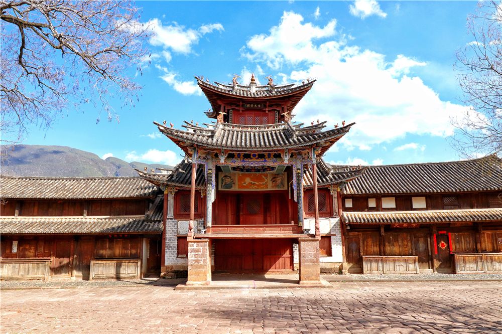 A traditional Chinese temple with intricate architectural details and a multi-tiered roof, surrounde