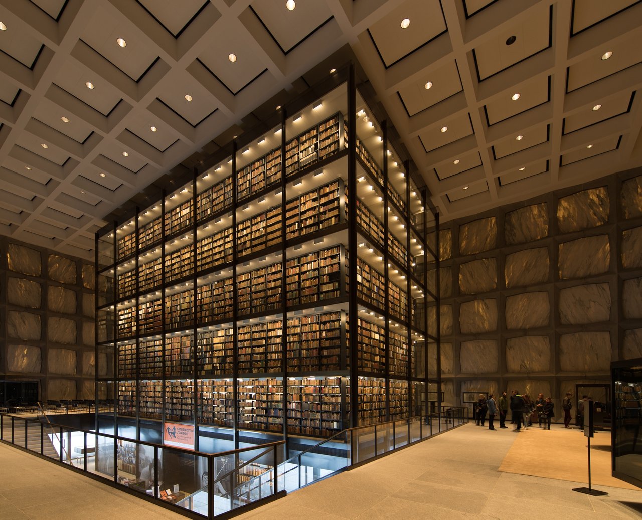 The six-story glass book tower rising through Beinecke’s exhibition hall
