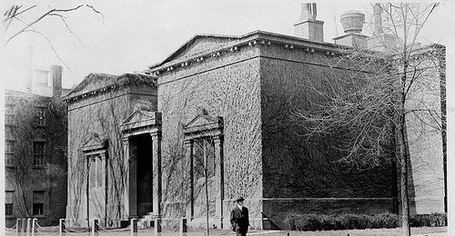 Historic angled exterior of the enlarged Skull and Bones building, showing several brownstone blocks and the formal entrance