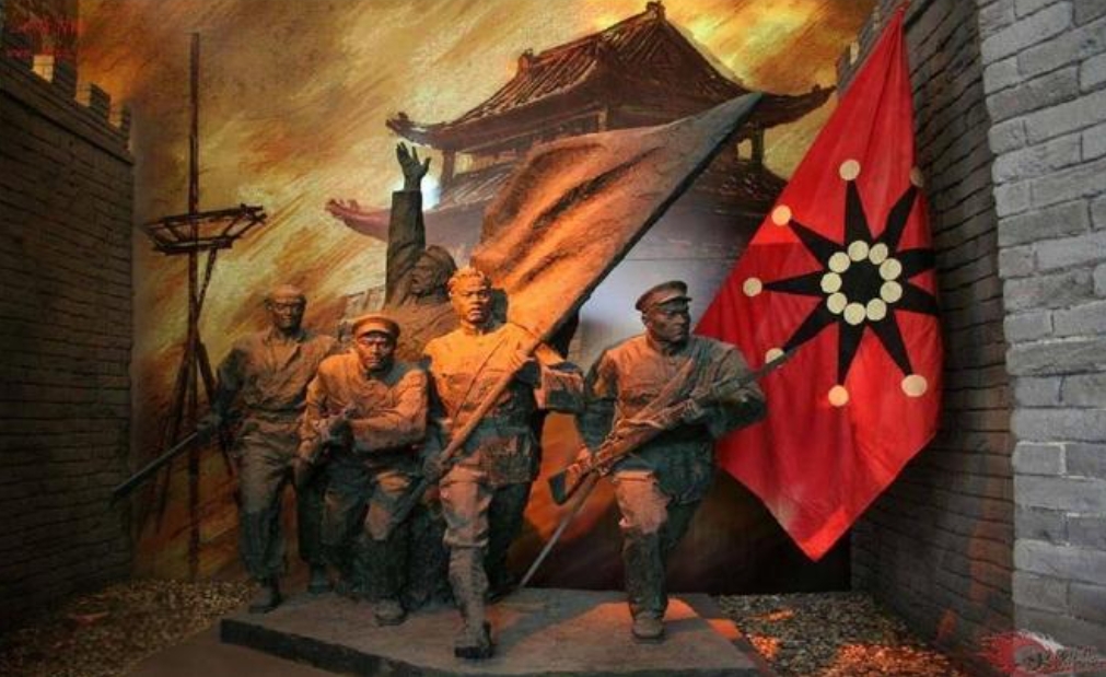A statue depicts two political parties teaching military training together before leaving Huangpu Military Academy in Gu