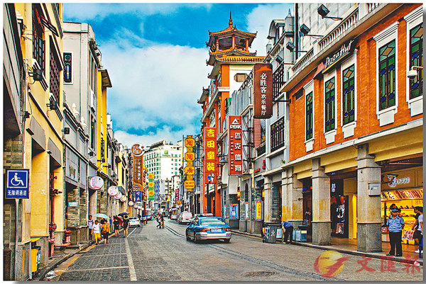 A traditional street with arch-shaped walkways on the upper levels, lined with colorful shops and signs, features a pago