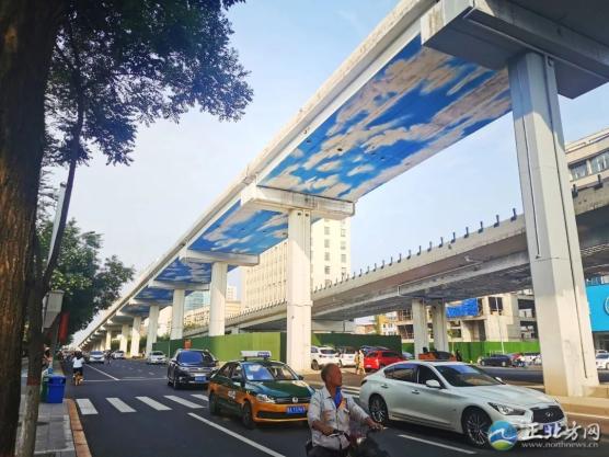 A street scene in Hohhot with an elevated highway featuring sky and cloud imager