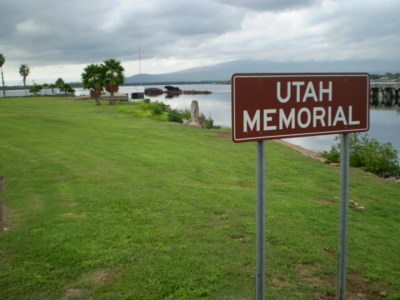 USS Utah Memorial walkway extending toward the water with visible wreck area