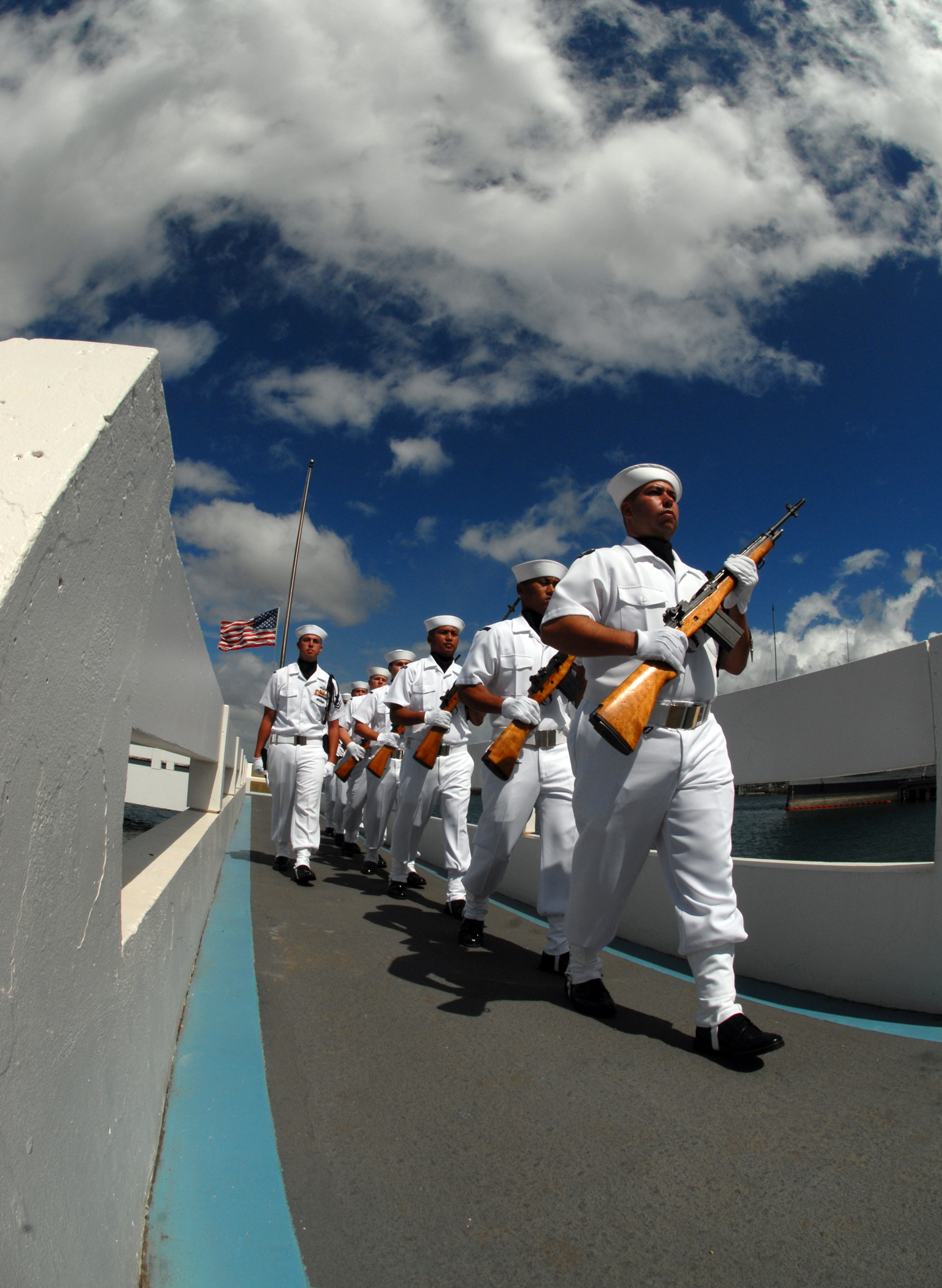 Navy Region Hawaii Ceremonial Guard marching from the pier of USS Utah Memorial