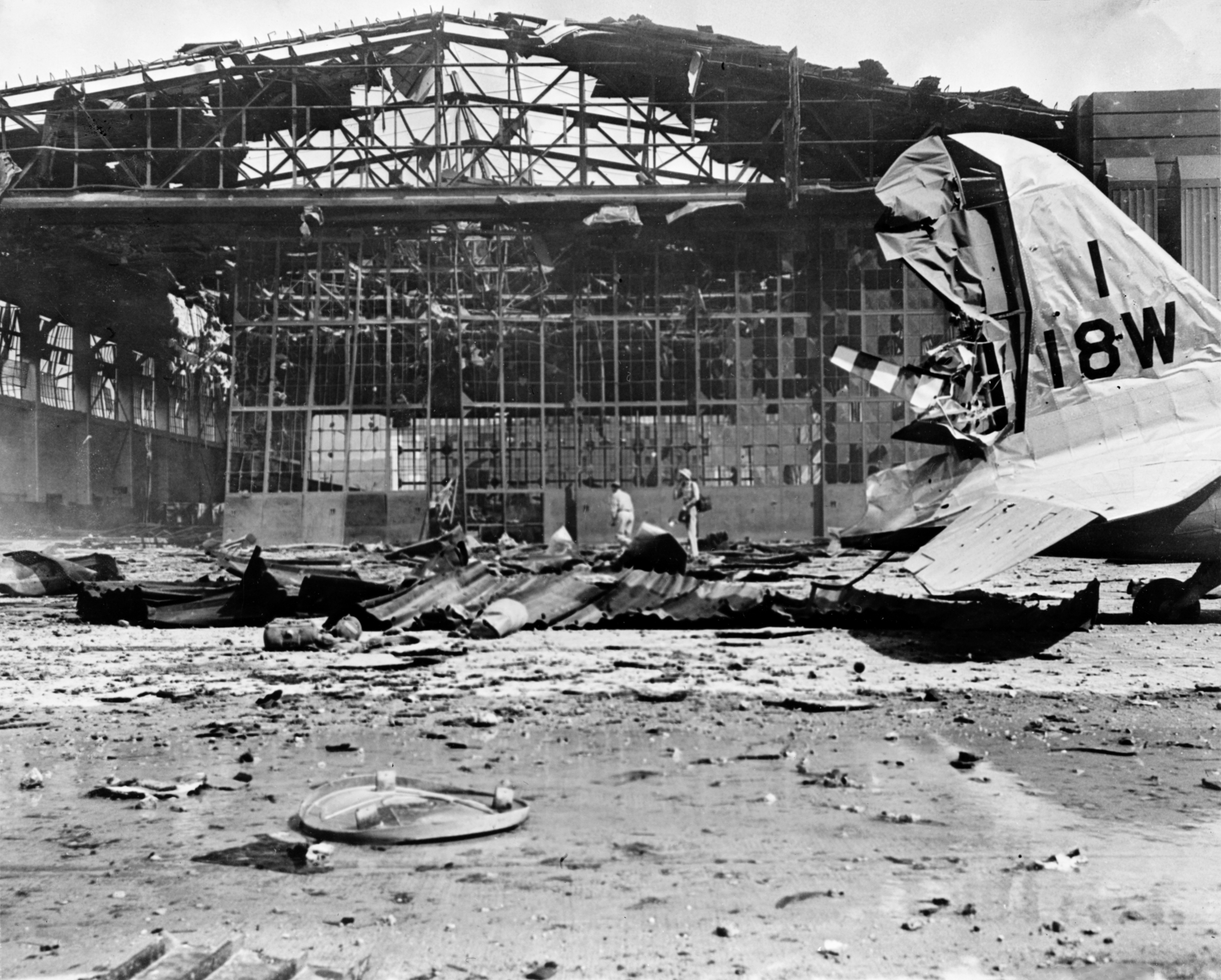 Heavily damaged Hangar No. 11 and a Douglas B-18 at Hickam Field on December 7, 1941