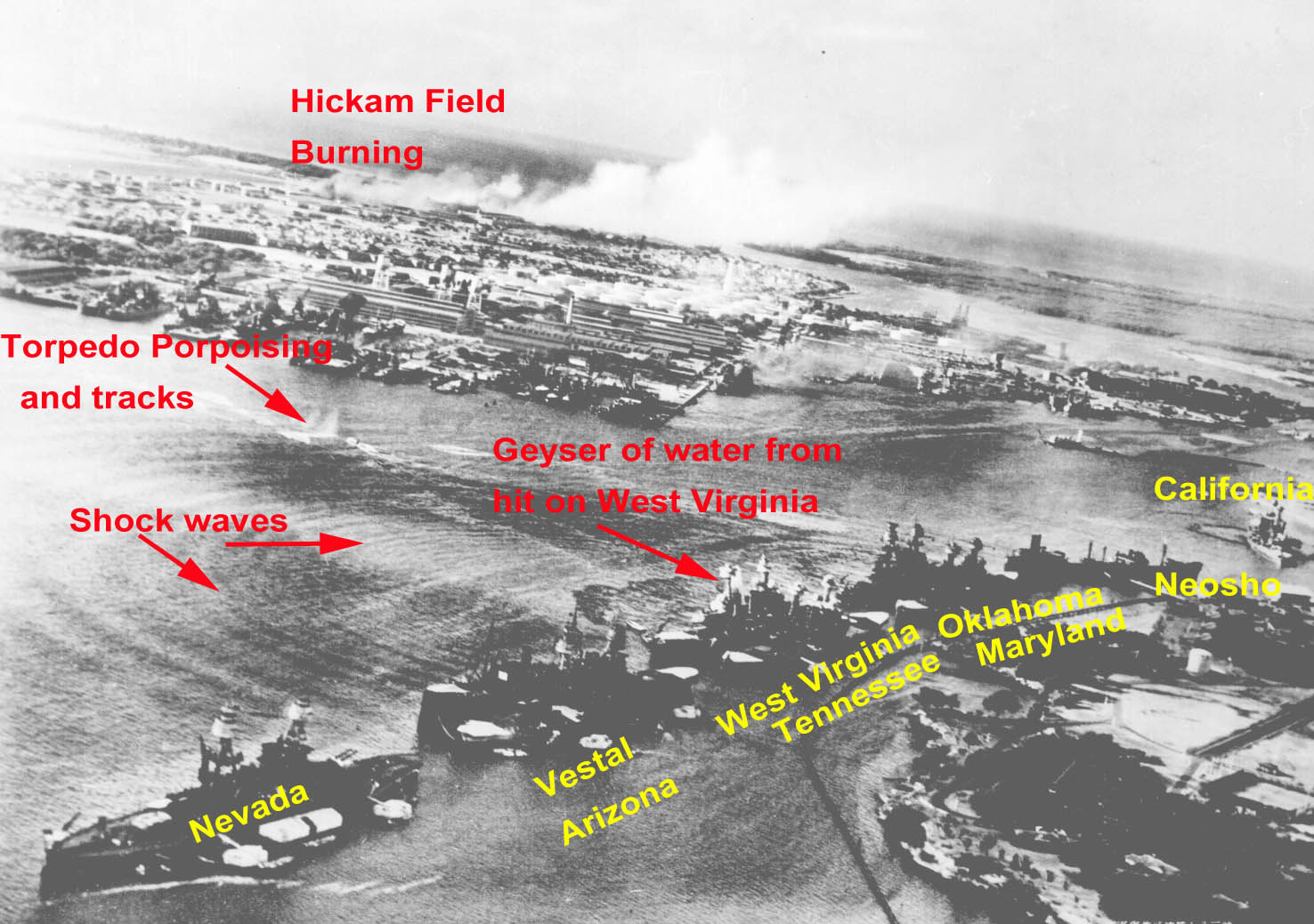 Captured Japanese aerial view of Pearl Harbor with smoke rising from both Battleship Row and Hickam Field