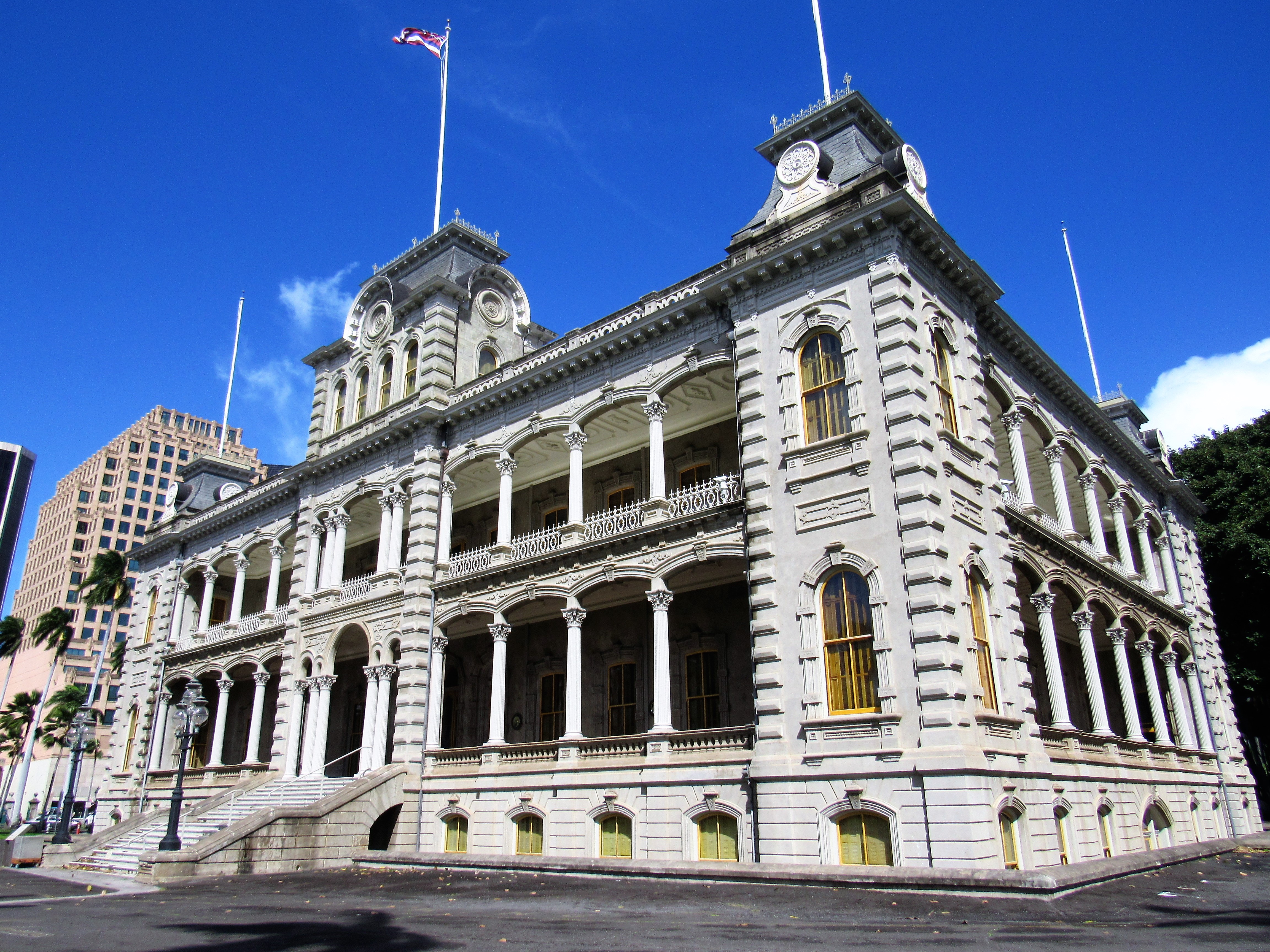 ʻIolani Palace exterior with the front lawn and corner towers