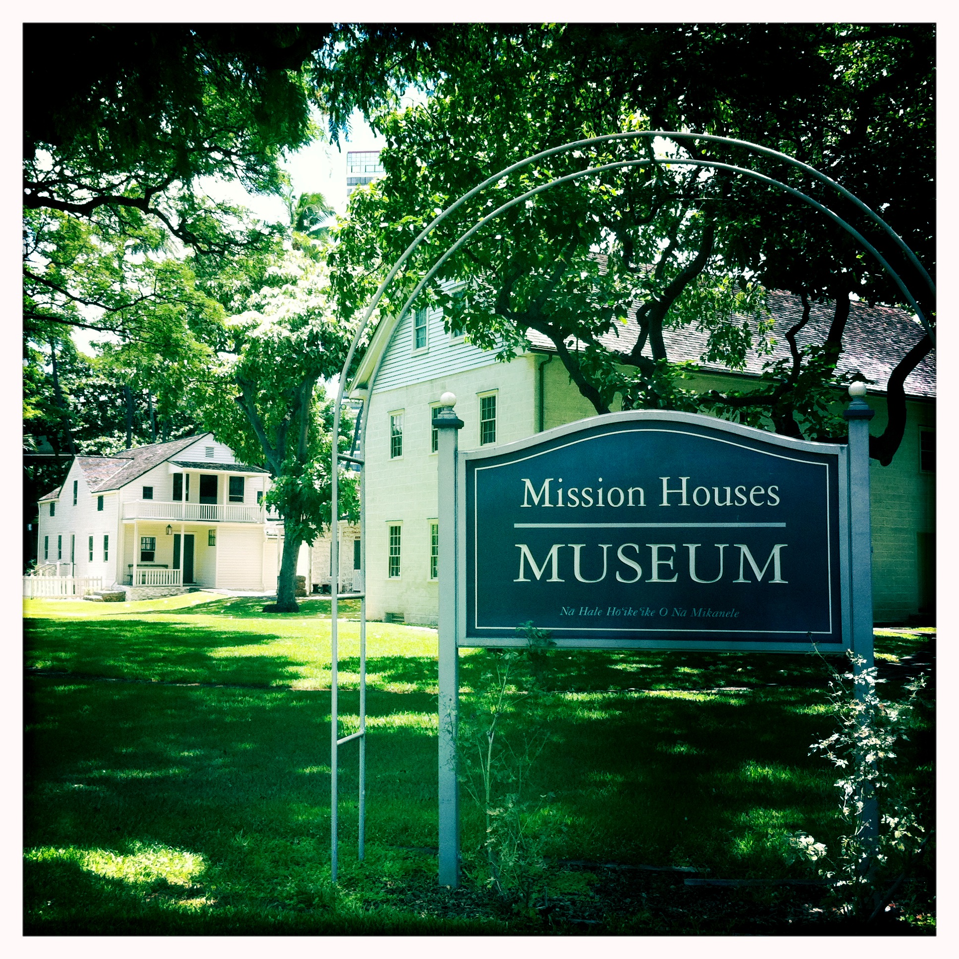 Mission Houses Museum frontage from King Street, showing the low wooden compound buildings