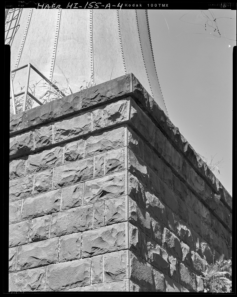 Stone corbeled cornice detail on the smokestack base