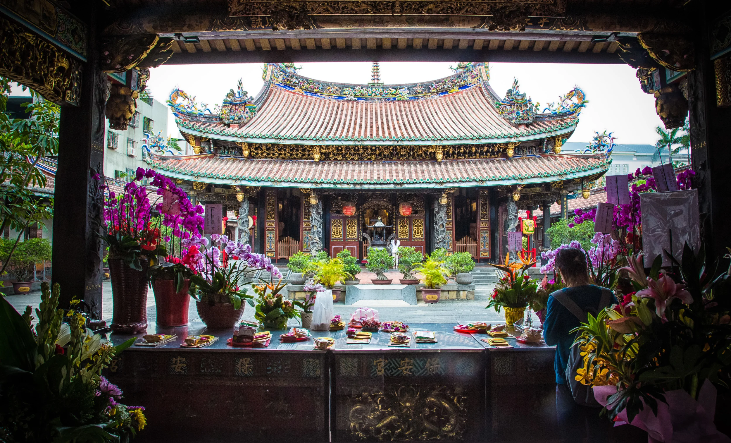 A richly decorated traditional Taiwanese temple with ornate carvings and vibrant