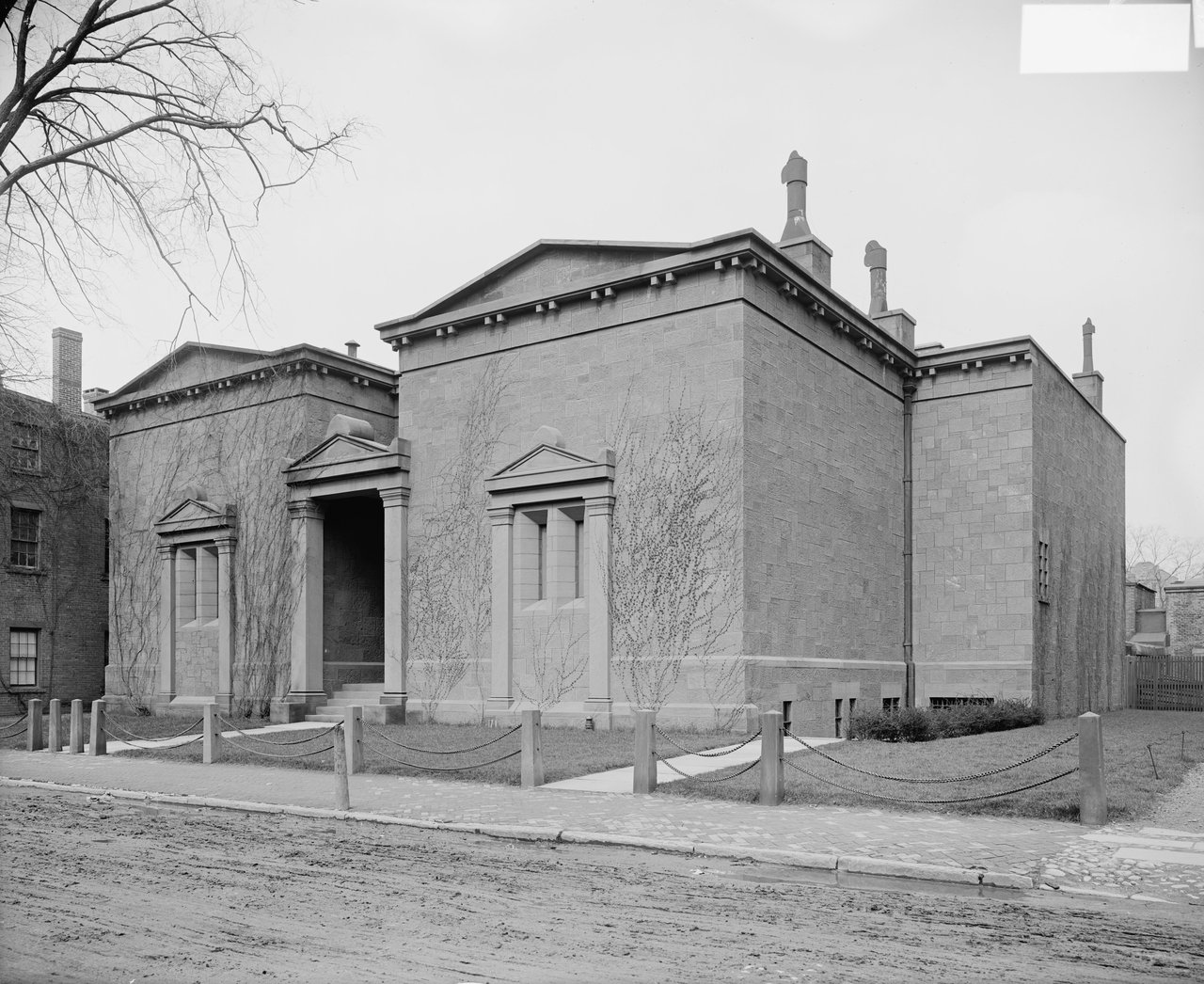 Skull and Bones tomb full exterior at street level with trees and fence