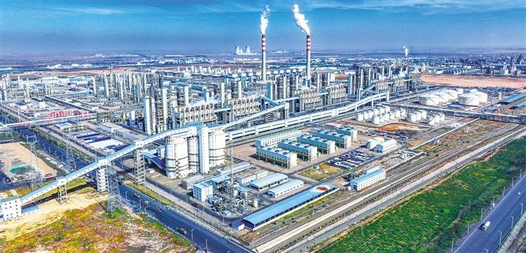 A large industrial complex with numerous factories, pipelines, and smokestacks e